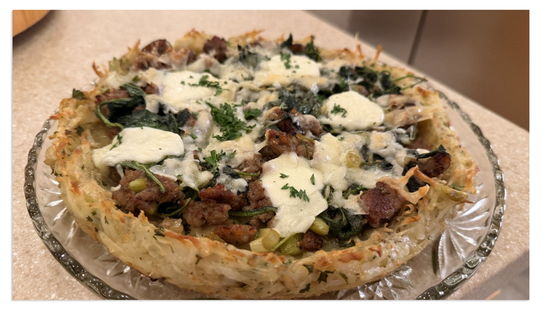 Potato pie with Italian sausage and spinach